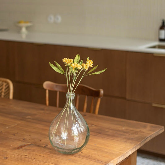 Wild daisies in yellow paper